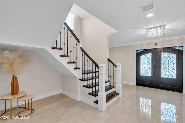 entrance foyer featuring stairway, french doors, visible vents, and baseboards