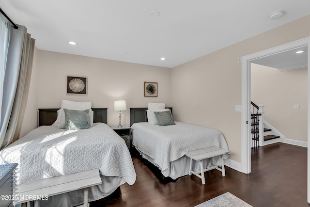 bedroom with recessed lighting, baseboards, and dark wood finished floors