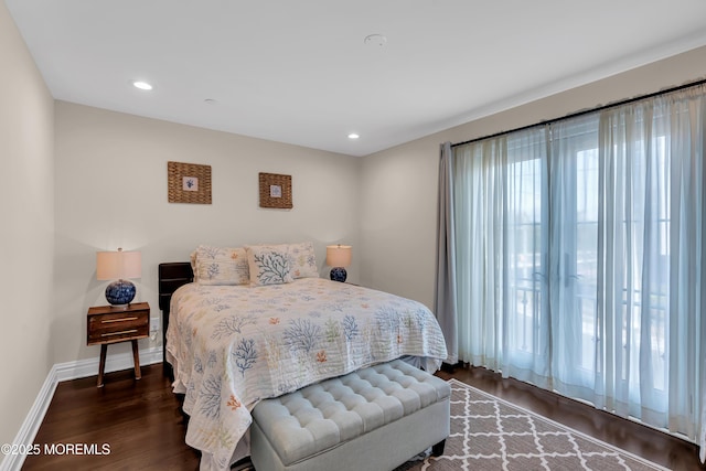 bedroom with recessed lighting, baseboards, and wood finished floors