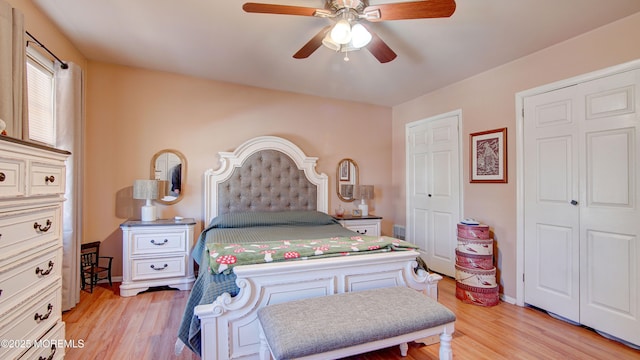 bedroom featuring light wood finished floors, ceiling fan, and baseboards