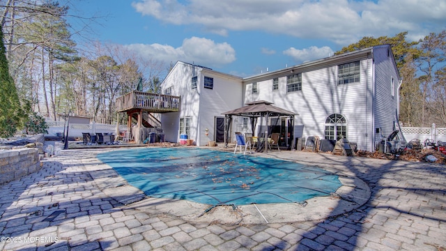 view of pool featuring a deck, a gazebo, a patio area, and a fenced in pool