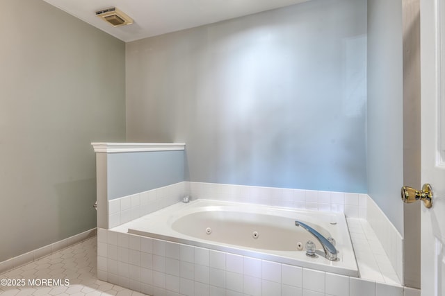 bathroom with tile patterned floors, a jetted tub, and visible vents