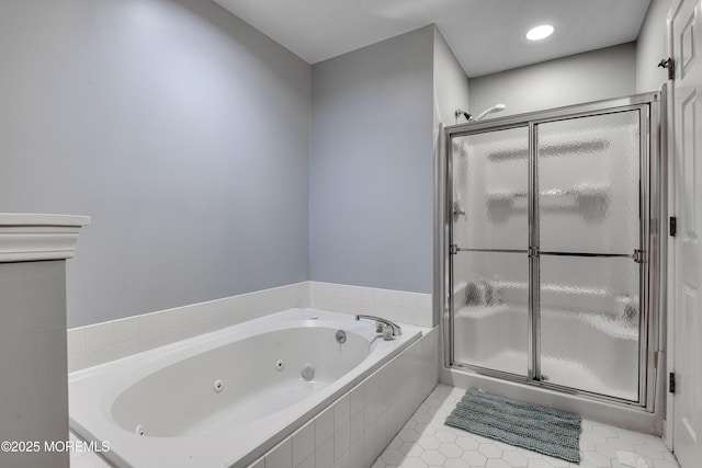 full bathroom featuring tile patterned flooring, a shower stall, and a whirlpool tub