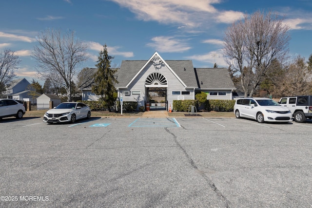 view of building exterior featuring uncovered parking