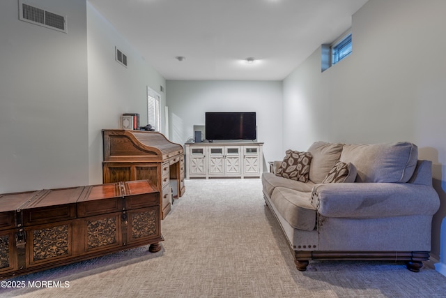 carpeted living room featuring visible vents