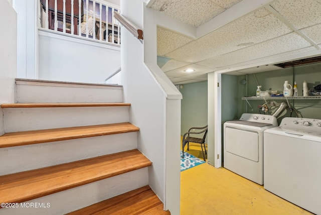 clothes washing area with laundry area and independent washer and dryer