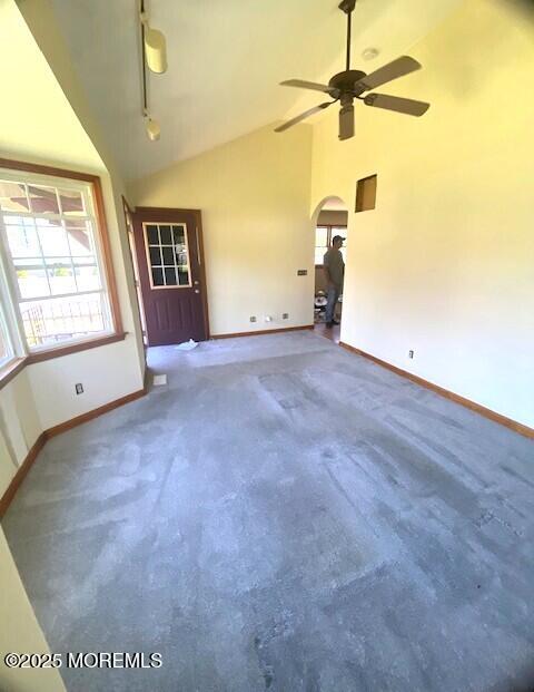 14 Woodrow St, Oakhurst, NJ 07755 - spare room with arched walkways, baseboards, carpet flooring, a ceiling fan, and high vaulted ceiling