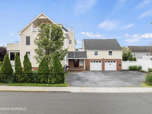 18 Riverdale Ave, Monmouth Beach, NJ 07750 - view of front of home with brick siding, driveway, a chimney, and an attached garage