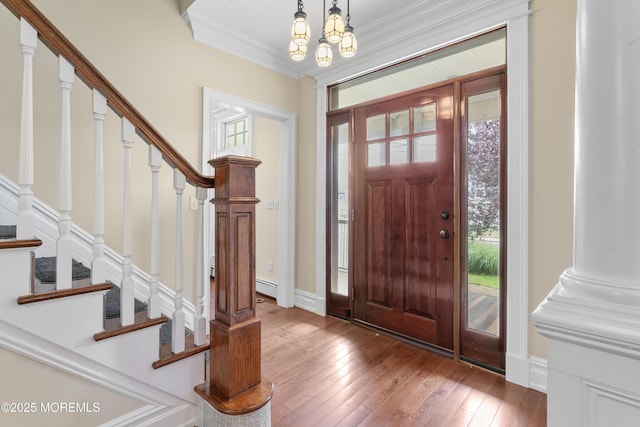 18 Riverdale Ave, Monmouth Beach, NJ 07750 - foyer entrance with stairway, wood-type flooring, crown molding, a chandelier, and baseboards