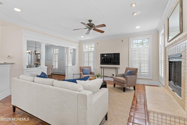 18 Riverdale Ave, Monmouth Beach, NJ 07750 - living room with a fireplace with flush hearth, plenty of natural light, tile patterned flooring, ornamental molding, and recessed lighting