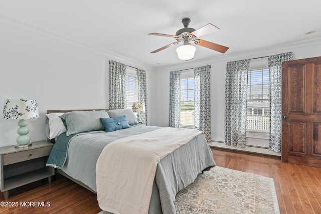 18 Riverdale Ave, Monmouth Beach, NJ 07750 - bedroom featuring ornamental molding, wood finished floors, a baseboard radiator, and a ceiling fan