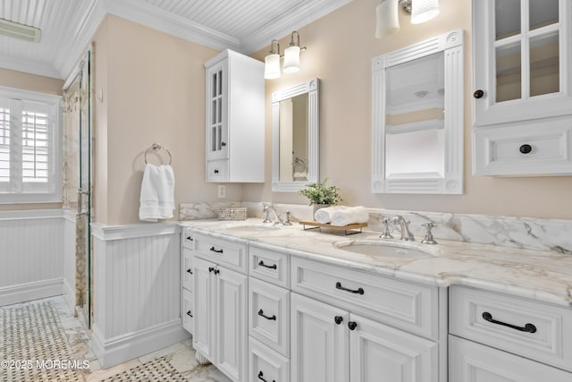 18 Riverdale Ave, Monmouth Beach, NJ 07750 - bathroom featuring double vanity, a wainscoted wall, ornamental molding, and a shower