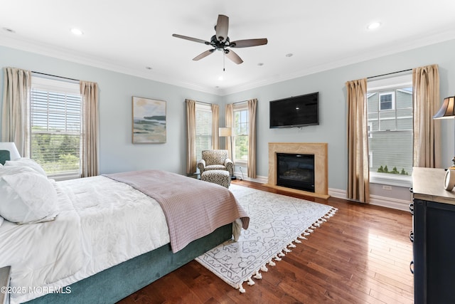 18 Riverdale Ave, Monmouth Beach, NJ 07750 - bedroom featuring multiple windows, ornamental molding, wood finished floors, a glass covered fireplace, and recessed lighting