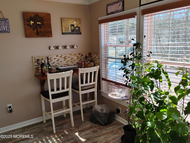 dining area with wood finished floors and baseboards