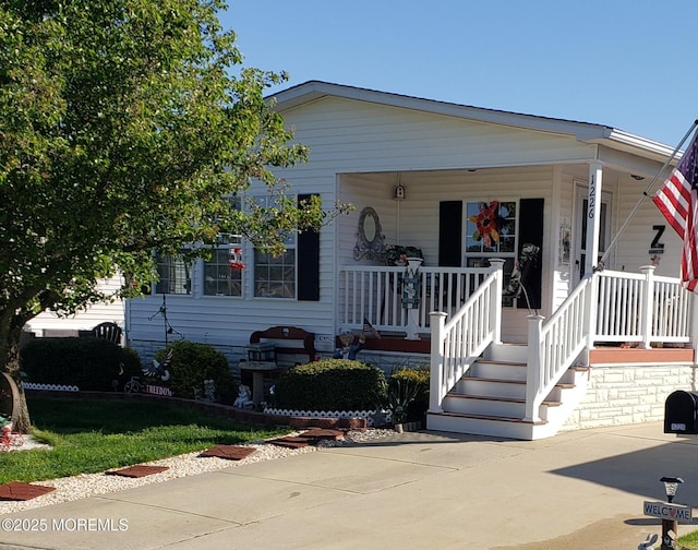 view of front of home featuring covered porch