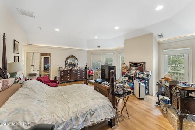 bedroom with light wood-style flooring, visible vents, and recessed lighting