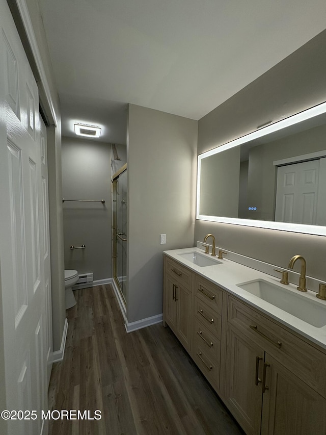 bathroom with toilet, a stall shower, visible vents, and a sink