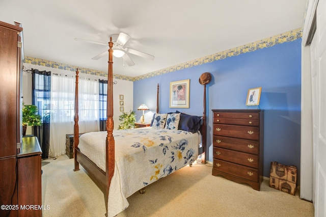 bedroom with carpet floors and a ceiling fan