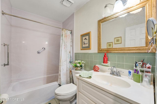 bathroom with toilet, shower / tub combo with curtain, tile walls, and vanity