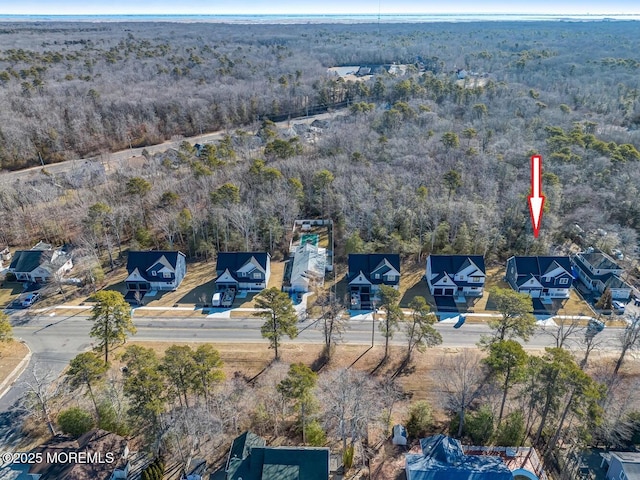 aerial view featuring a wooded view