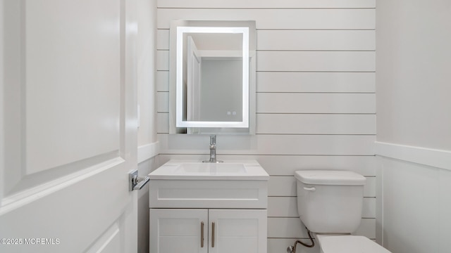 half bath with vanity and toilet