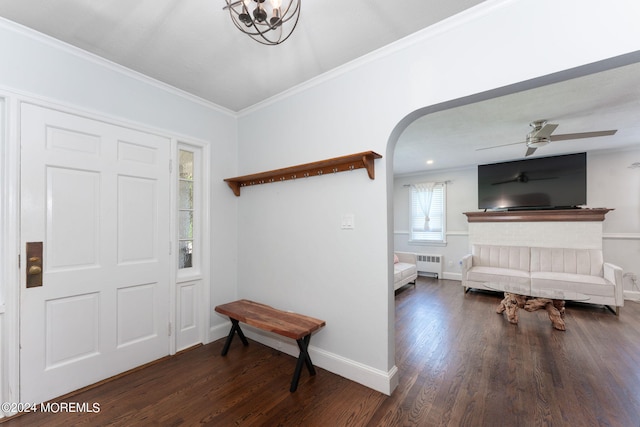 entryway with arched walkways, ornamental molding, radiator, and wood finished floors