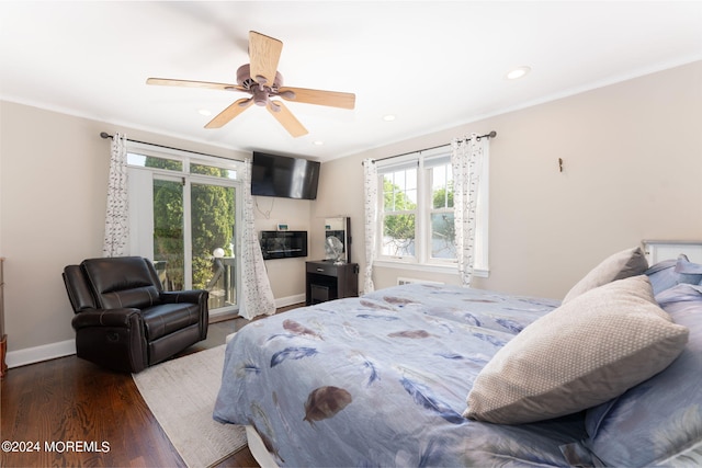 bedroom featuring wood finished floors, baseboards, recessed lighting, ornamental molding, and access to outside