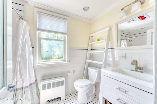 bathroom with visible vents, crown molding, toilet, radiator heating unit, and tile walls