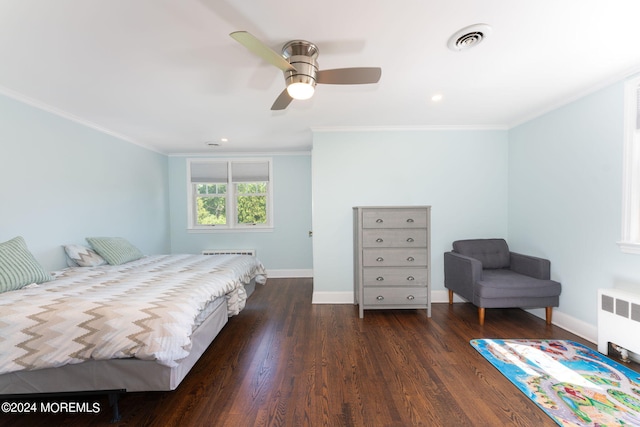 bedroom featuring dark wood-style floors, visible vents, crown molding, and radiator heating unit