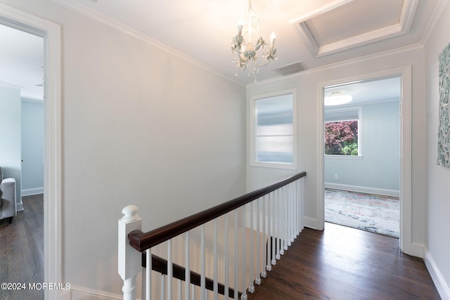 hallway featuring an upstairs landing, visible vents, dark wood-style flooring, and ornamental molding