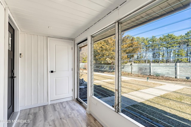 doorway to outside featuring wood finished floors