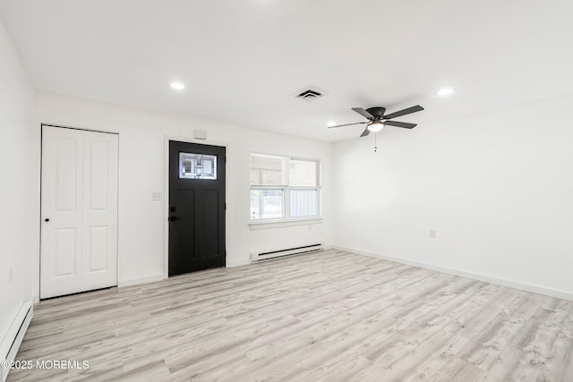 foyer entrance featuring light wood-type flooring, a baseboard heating unit, visible vents, and recessed lighting