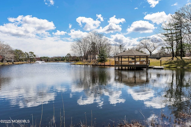 view of dock with a water view and a gazebo