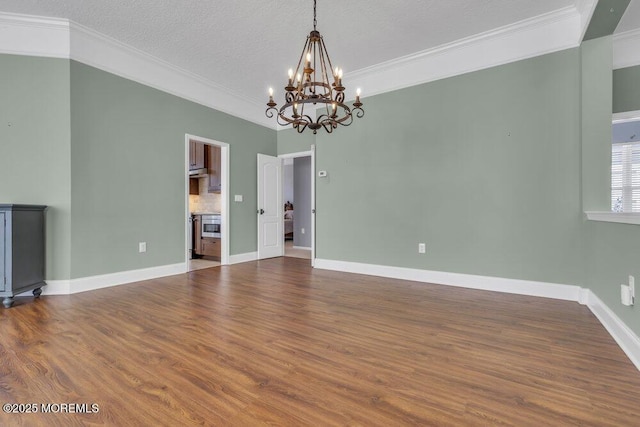 interior space with dark wood-style floors, ornamental molding, and baseboards