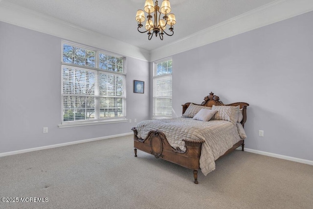 carpeted bedroom with baseboards, ornamental molding, and a chandelier