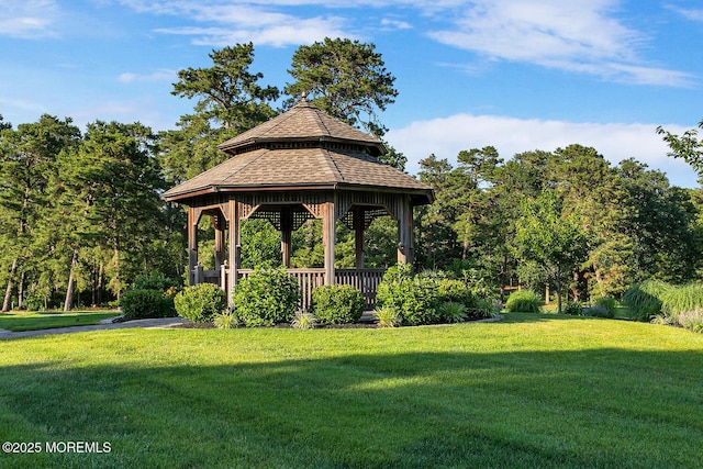 view of property's community featuring a yard and a gazebo