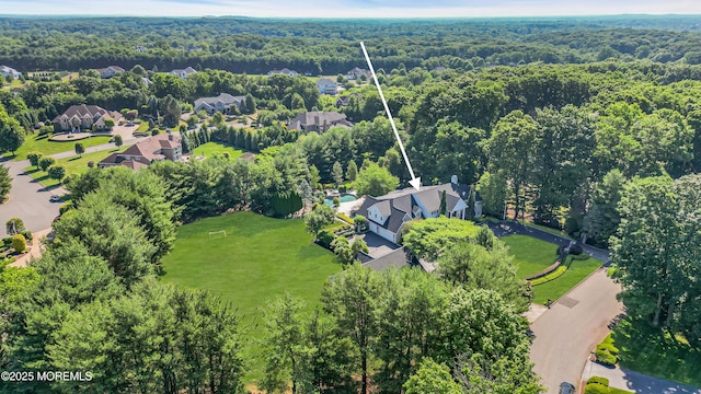 aerial view with a view of trees and a residential view