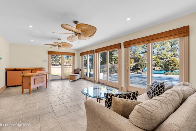 living room with recessed lighting, baseboards, and ceiling fan