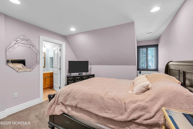 bedroom featuring recessed lighting, light colored carpet, baseboards, and connected bathroom