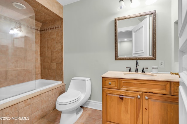 full bath with vanity, tile patterned floors, toilet, and tiled shower / bath