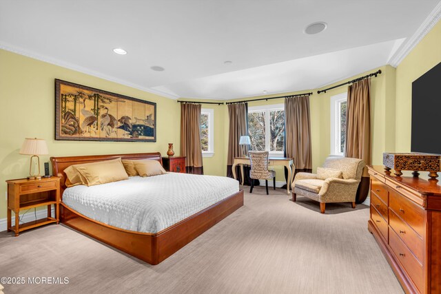 bedroom featuring baseboards, light carpet, and crown molding