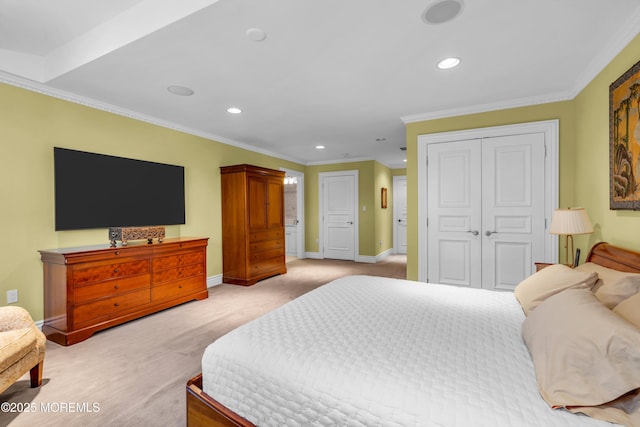 bedroom featuring a closet, light carpet, crown molding, and baseboards