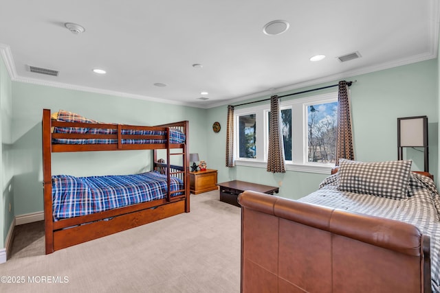 bedroom with visible vents, carpet floors, baseboards, and crown molding