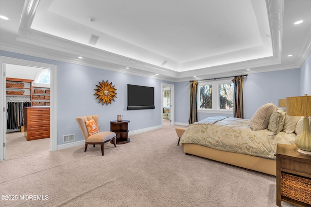 bedroom featuring light carpet, visible vents, a raised ceiling, and baseboards