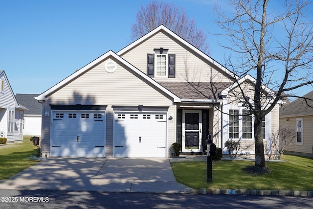 view of front of house featuring driveway, a shingled roof, and a front yard