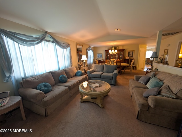 living room with an inviting chandelier, visible vents, vaulted ceiling, and carpet flooring