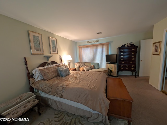 bedroom with carpet floors and visible vents