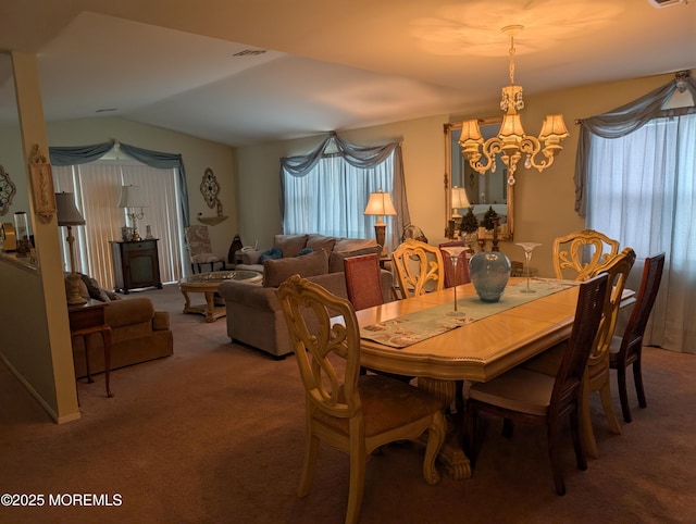 dining space with light carpet, plenty of natural light, visible vents, and an inviting chandelier