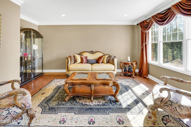 living room featuring recessed lighting, crown molding, baseboards, and wood finished floors