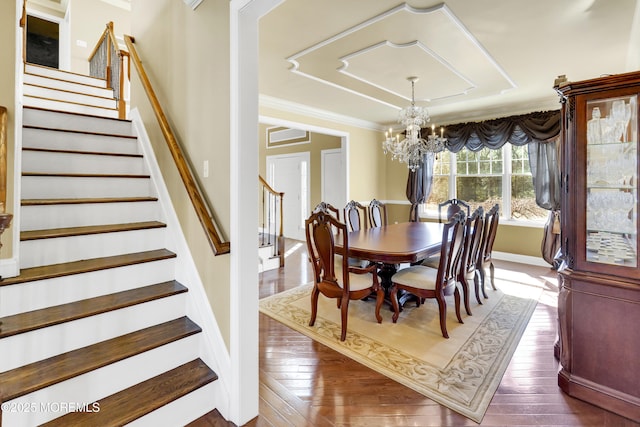 dining room with stairs, a notable chandelier, dark wood-style floors, and crown molding